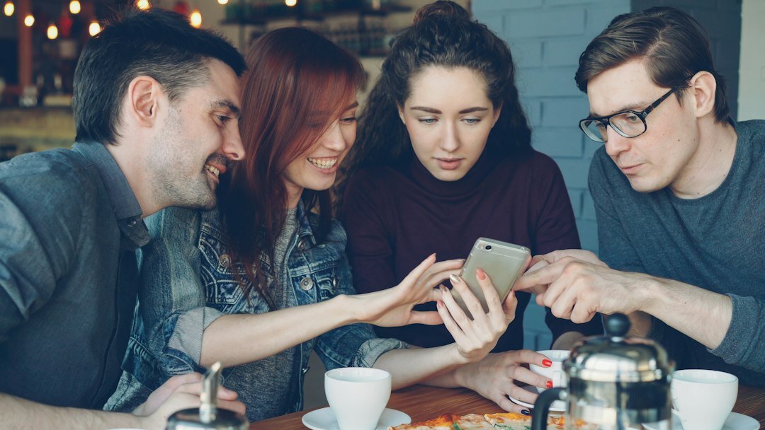 group of friends discussing online trends